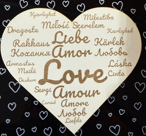 Heart-shaped word cloud made with white plywood and black acrylic